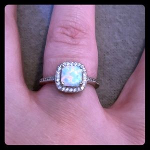 Lab created opal halo ring with CZ diamond accents